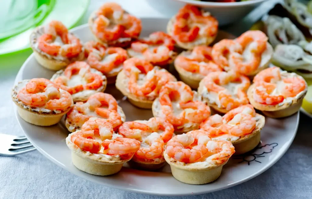 Delicious shrimp tartlets are an easy appetizer that adds a touch of seafood to a themed beach party.